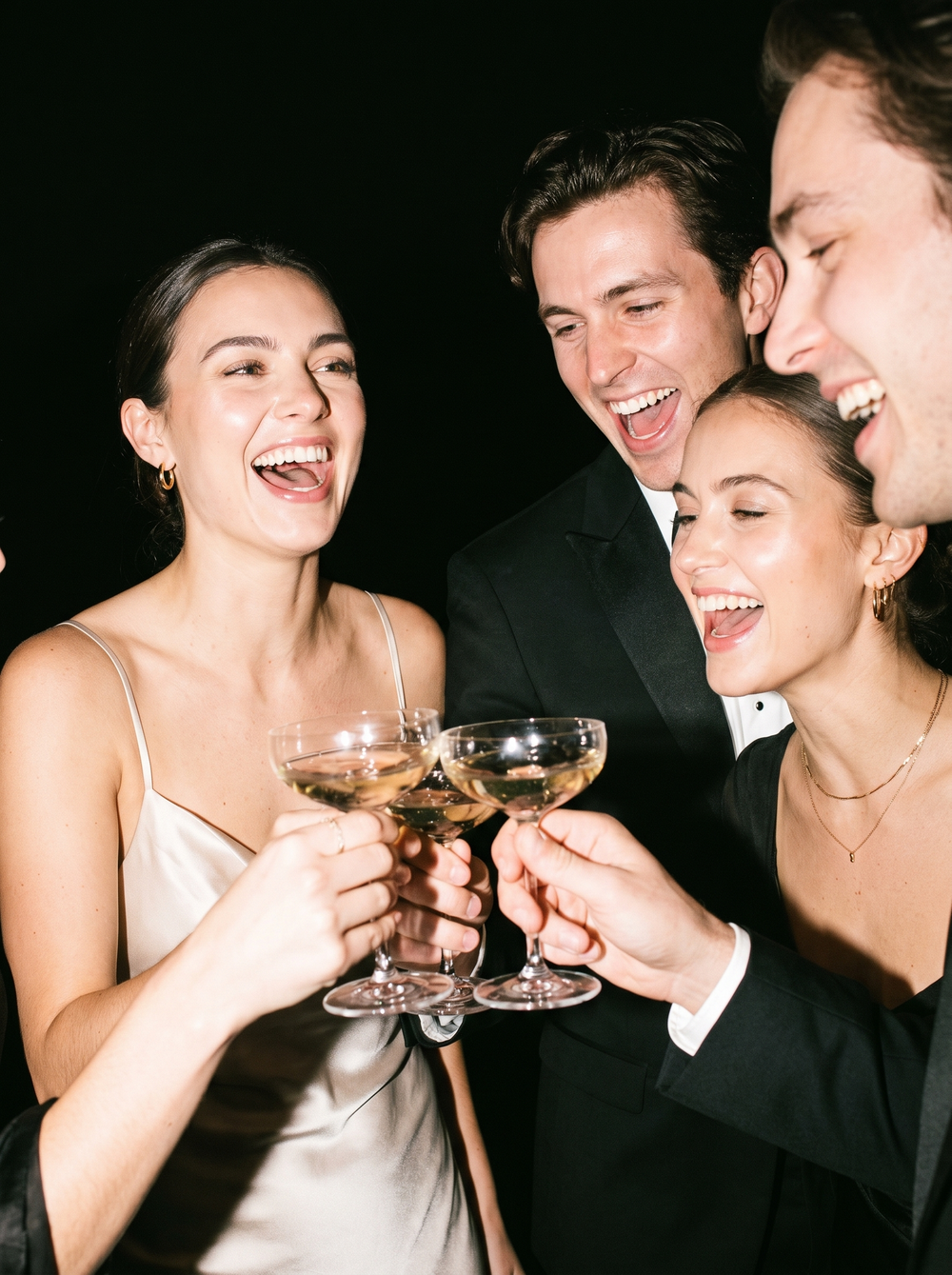 Friends toasting with champagne on a night out